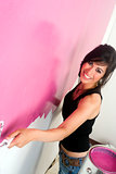 Woman Smiling While Do it Yourself Paint the Walls Home Project