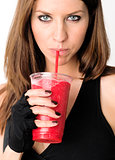 Girl with Refreshing Red Fruit Smoothie after Gym Workout