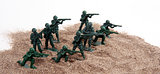Toy Army Men in Pile of Sand
