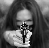 Masked Woman Pointing Gun Right at Camera