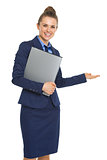 Smiling business woman with documents welcoming