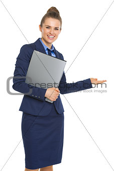 Smiling business woman with documents welcoming