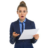 Concerned business woman with document