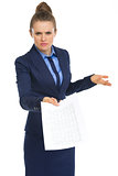 Displeased business woman with document