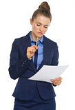 Business woman examining document