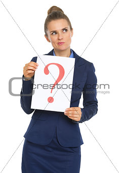 Thoughtful business woman showing paper sheet with question mark