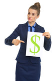 Business woman pointing on paper sheet with dollar sign