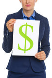 Closeup on business woman showing paper sheet with dollar sign