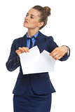 Displeased business woman tearing documents