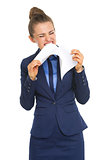Angry business woman tearing documents