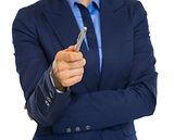 Closeup on business woman pointing with in camera pen