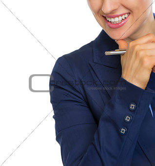 Closeup on smiling business woman with pen