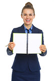 Smiling business woman showing open notepad