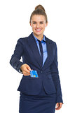 Smiling business woman giving credit card