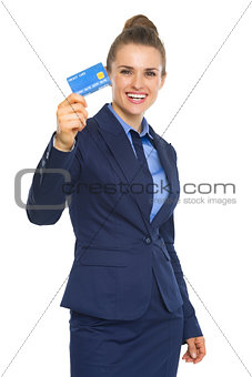 Smiling business woman showing credit card