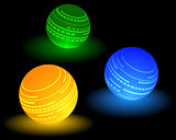 three multi-colored ball
