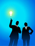 business team silhouettes with light bulb