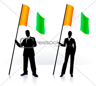 Business silhouettes with waving flag of Ireland