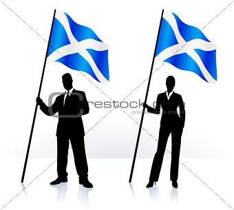Business silhouettes with waving flag of Scotland