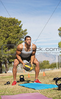Male Exercising with Medicine Ball