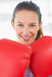 Closeup portrait of a smiling female boxer