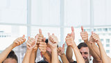 Closeup of cropped people gesturing thumbs up
