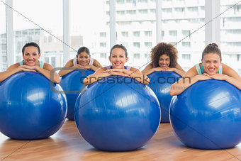 Portrait of smiling people with exercise balls