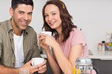 Portrait of a happy loving couple with coffee cup