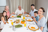 Portrait of an extended family at dining table