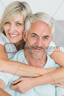 Portrait of a loving mature couple in bed