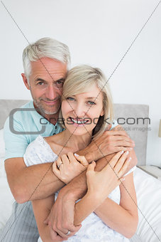 Portrait of a loving mature man embracing woman