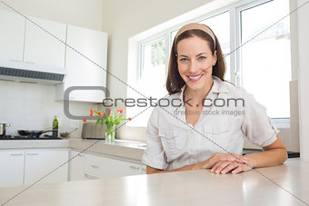 Portrait of a smiling woman in kitchen