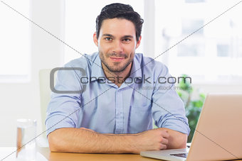 Confident businessman at desk
