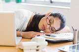 Businesswoman sleeping on desk