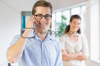 Businessman using cellphone in office