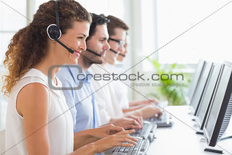 Customer service representatives working at desk