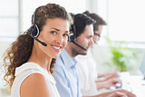 Call center operator wearing headset in office
