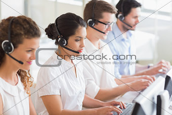 Customer service operators working at desk