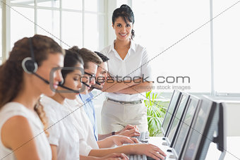 Happy manager working in a call center