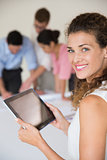 Beautiful businesswoman holding digital tablet