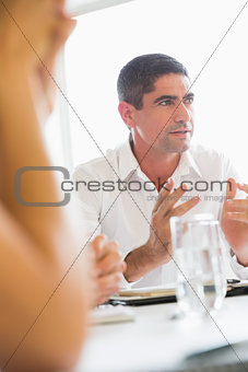 Confident businessman explaining strategy