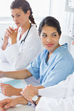 Female nurse with doctors