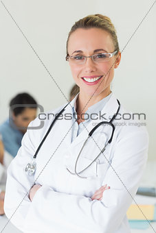 Beautiful doctor standing arms crossed