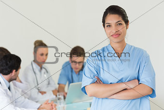 Female nurse standing arms crossed