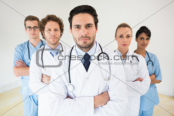 Medical team standing arms crossed