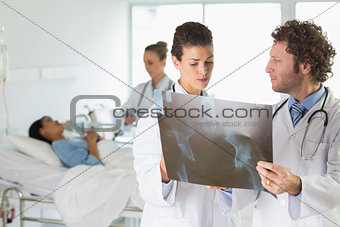 Doctors examining Xray in hospital