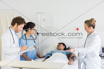 Medical team examining patient