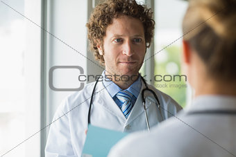 Doctor looking at colleague