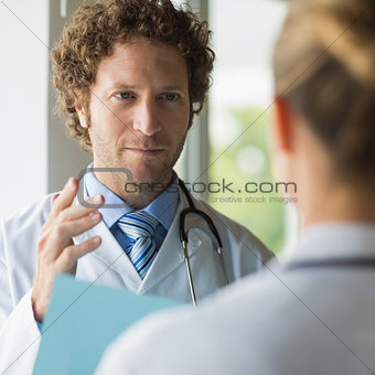 Doctor discussing with female colleague