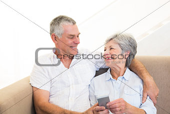 Couple using mobile phone